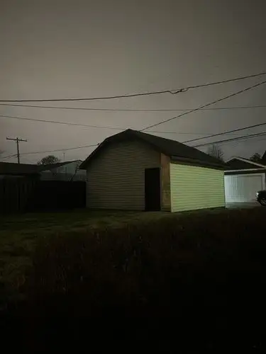 Night falls quietly on this lone garage.